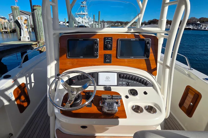  Yacht Photos Pics 2013 Boston Whaler 320 Outrage helm with dual displays and steering wheel.