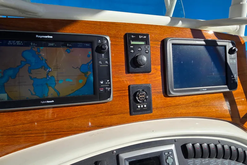  Yacht Photos Pics Dashboard of a 2013 Boston Whaler 320 Outrage with navigation screens and controls.