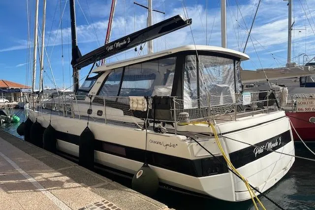 Petit Miracle 2 Yacht Photos Pics 2018 Beneteau Oceanis Yacht 62 docked at marina under clear blue sky.