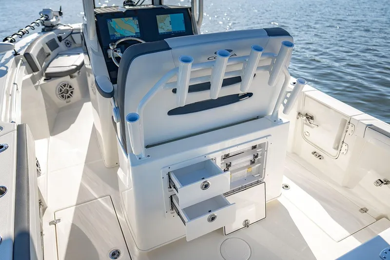  Yacht Photos Pics Manufacturer Provided Image: 2026 Cobia 245 Center Console boat interior with rod holders and storage drawers.