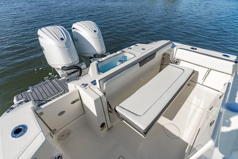  Yacht Photos Pics Manufacturer Provided Image: 2026 Cobia 245 Center Console boat with dual engines and spacious seating area.