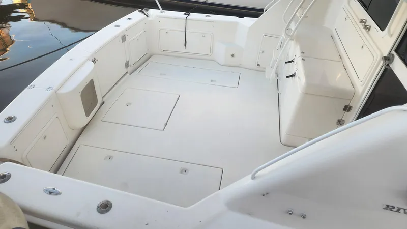 La Marce Yacht Photos Pics Spacious deck of 2002 Riviera 40 Flybridge yacht, featuring clean white surfaces.