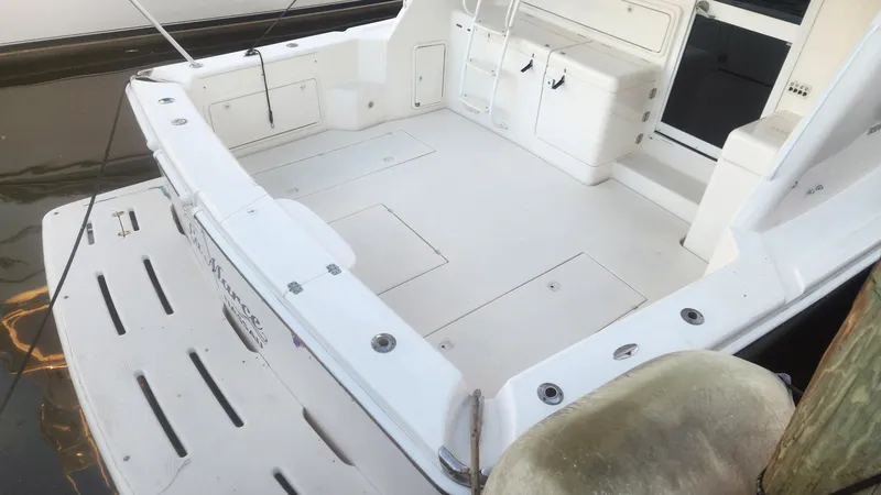 La Marce Yacht Photos Pics 2002 Riviera 40 Flybridge boat deck with seating and storage, docked at marina.