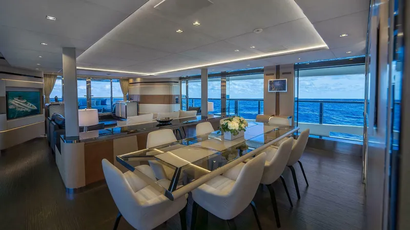 Neverland Yacht Photos Pics Luxurious interior of 2016 Mangusta Oceano 42 yacht with elegant dining area and ocean views.