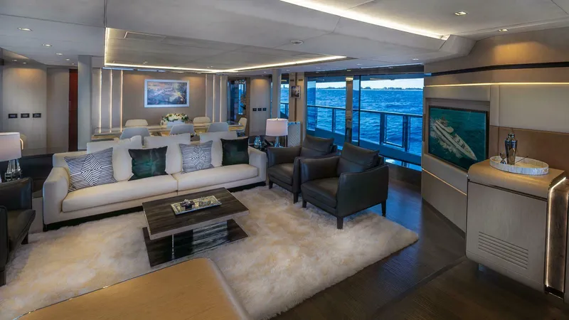 Neverland Yacht Photos Pics Luxurious interior of 2016 Mangusta Oceano 42 yacht with elegant seating and ocean view.