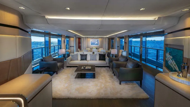 Neverland Yacht Photos Pics Luxurious interior of 2016 Mangusta Oceano 42 yacht with elegant seating and ocean views.