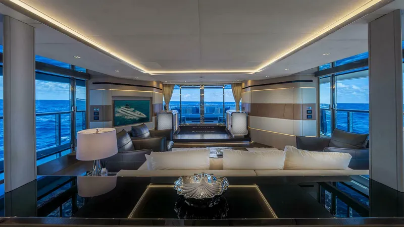 Neverland Yacht Photos Pics Luxurious interior of 2016 Mangusta Oceano 42 yacht with ocean views and elegant furnishings.