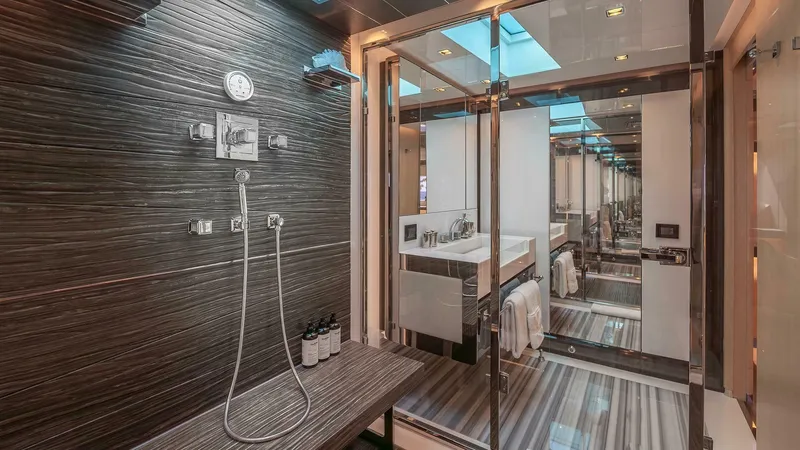Neverland Yacht Photos Pics Luxurious bathroom on 2016 Mangusta Oceano 42 yacht with modern shower and sleek design.