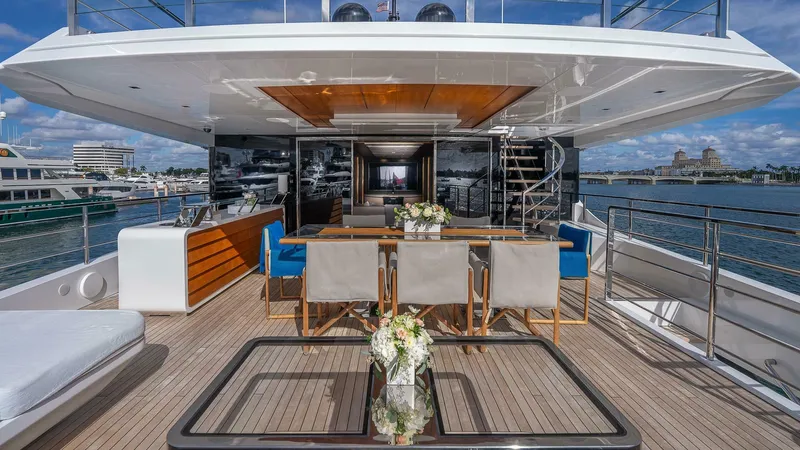 Neverland Yacht Photos Pics Luxurious 2016 Mangusta Oceano 42 yacht deck with elegant dining area and ocean view.