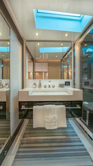 Neverland Yacht Photos Pics Luxurious bathroom in 2016 Mangusta Oceano 42 yacht with modern fixtures and skylight.