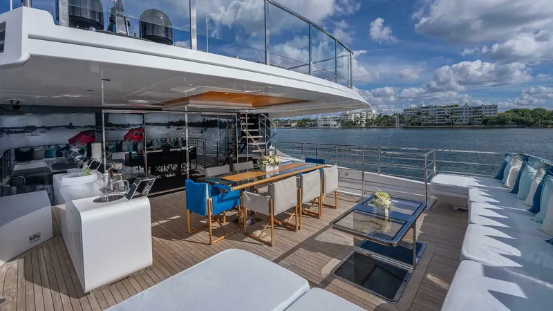 Neverland Yacht Photos Pics Luxurious deck of 2016 Mangusta Oceano 42 yacht with elegant seating and ocean view.