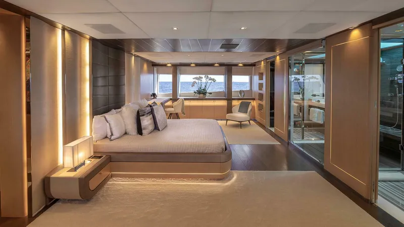 Neverland Yacht Photos Pics Luxurious bedroom interior of 2016 Mangusta Oceano 42 yacht with modern design and ocean view.