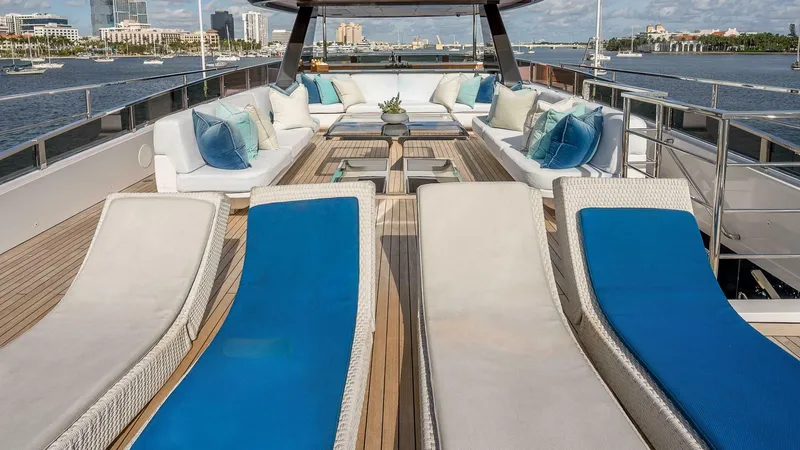 Neverland Yacht Photos Pics Luxurious deck of 2016 Mangusta Oceano 42 yacht with sun loungers and seating area.