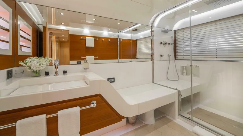 Neverland Yacht Photos Pics Luxurious bathroom on 2016 Mangusta Oceano 42 yacht with modern fixtures and elegant design.