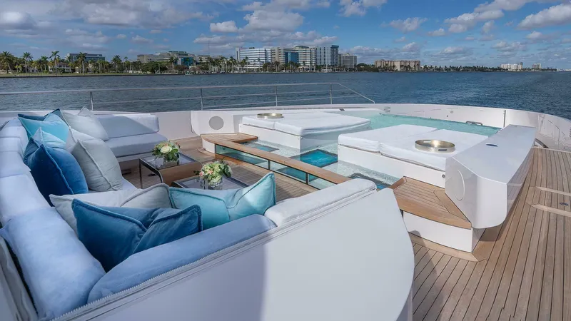 Neverland Yacht Photos Pics Luxurious deck of 2016 Mangusta Oceano 42 yacht with elegant seating and ocean view.