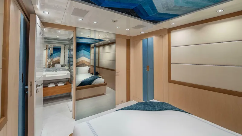 Neverland Yacht Photos Pics Luxurious interior of 2016 Mangusta Oceano 42 yacht cabin with modern design and elegant decor.
