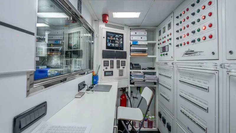 Neverland Yacht Photos Pics Control room of 2016 Mangusta Oceano 42 yacht with panels and equipment.