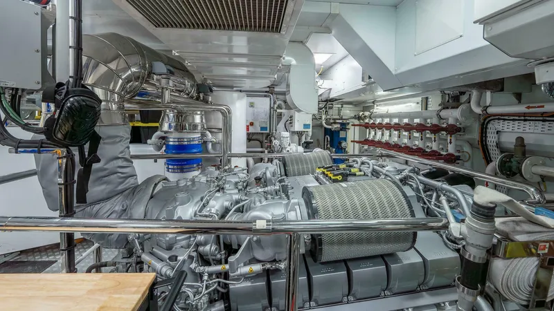 Neverland Yacht Photos Pics Engine room of 2016 Mangusta Oceano 42 yacht, showcasing advanced machinery and piping systems.