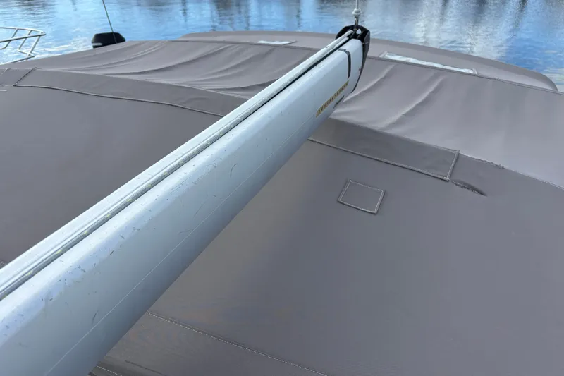 Eclipse Yacht Photos Pics 2018 Jeanneau Sun Odyssey 389 sailboat deck with boom, covered in protective canvas.