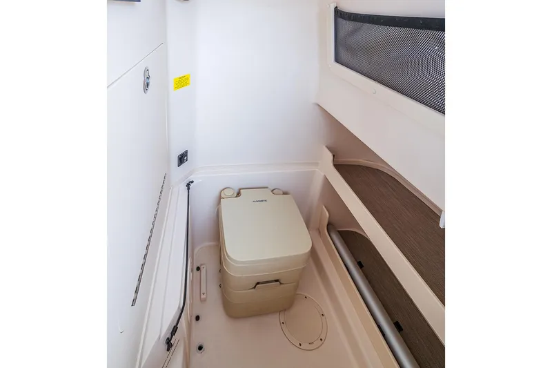  Yacht Photos Pics Manufacturer Provided Image: 2023 Grady-White Fisherman 257 boat interior with portable toilet.