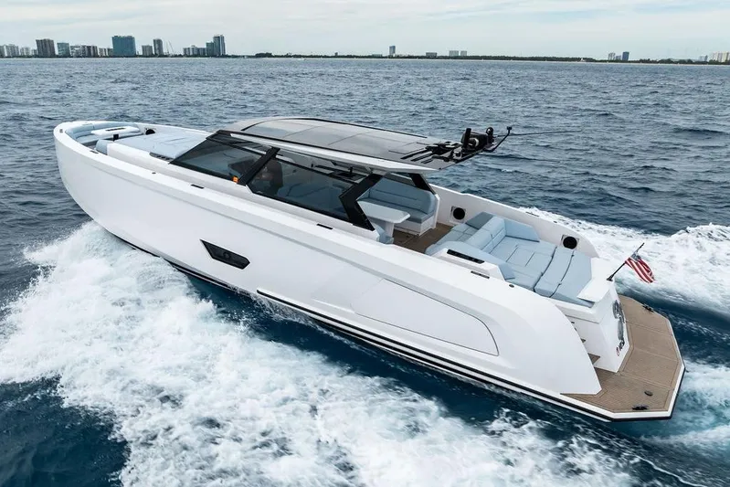 Shir Yacht Photos Pics 2024 Vanquish VQ58 yacht cruising on open water, showcasing sleek design and luxury.