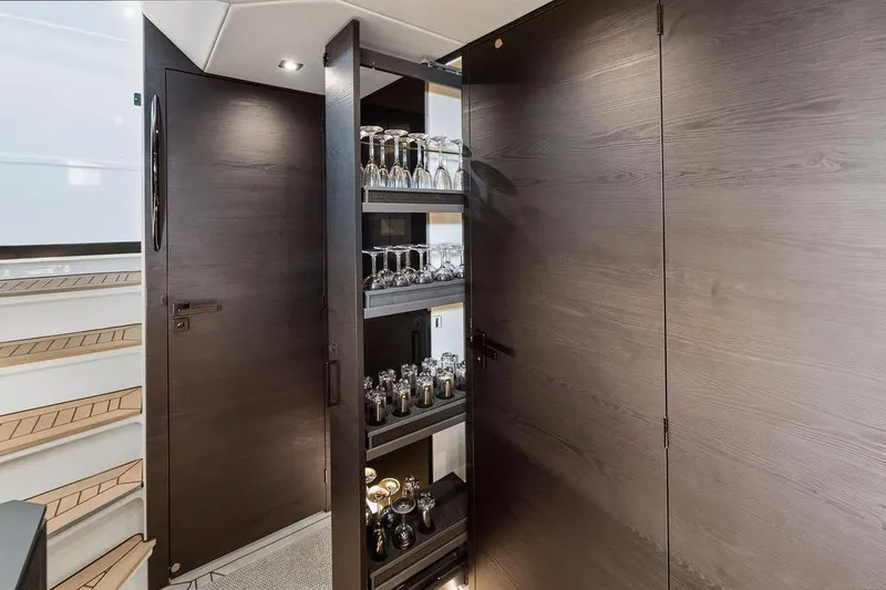 Shir Yacht Photos Pics Luxurious interior of 2024 Vanquish VQ58 yacht with elegant glassware storage.