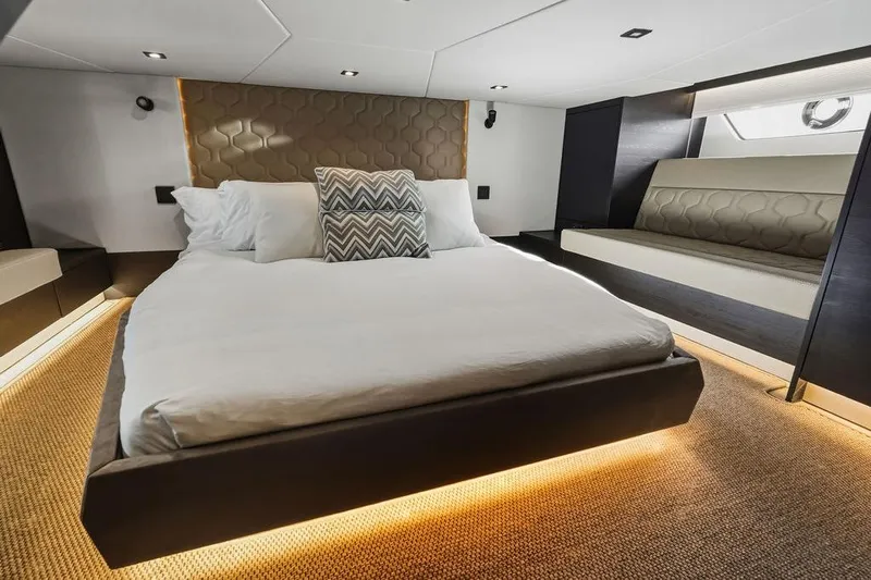 Shir Yacht Photos Pics Luxurious 2024 Vanquish VQ58 yacht bedroom with modern design and ambient lighting.