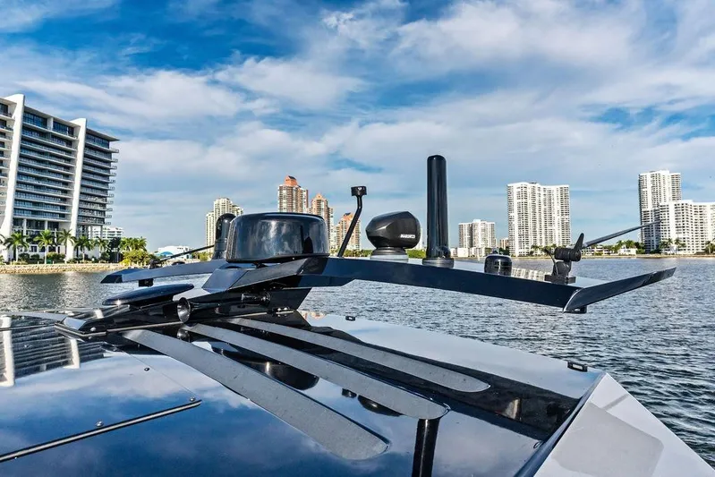 Shir Yacht Photos Pics 2024 Vanquish VQ58 yacht with city skyline and waterfront view.