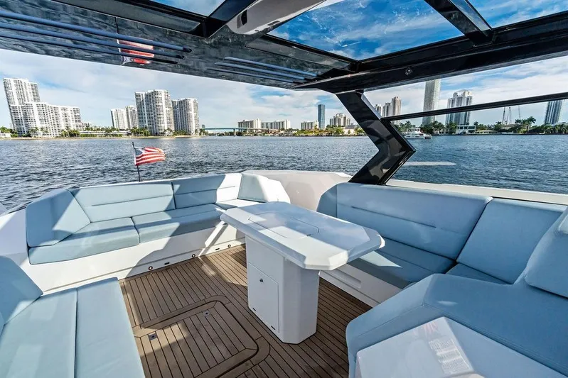 Shir Yacht Photos Pics Luxurious 2024 Vanquish VQ58 yacht interior with city skyline view.