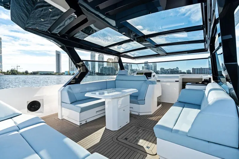 Shir Yacht Photos Pics Luxurious 2024 Vanquish VQ58 yacht interior with spacious seating and panoramic views.