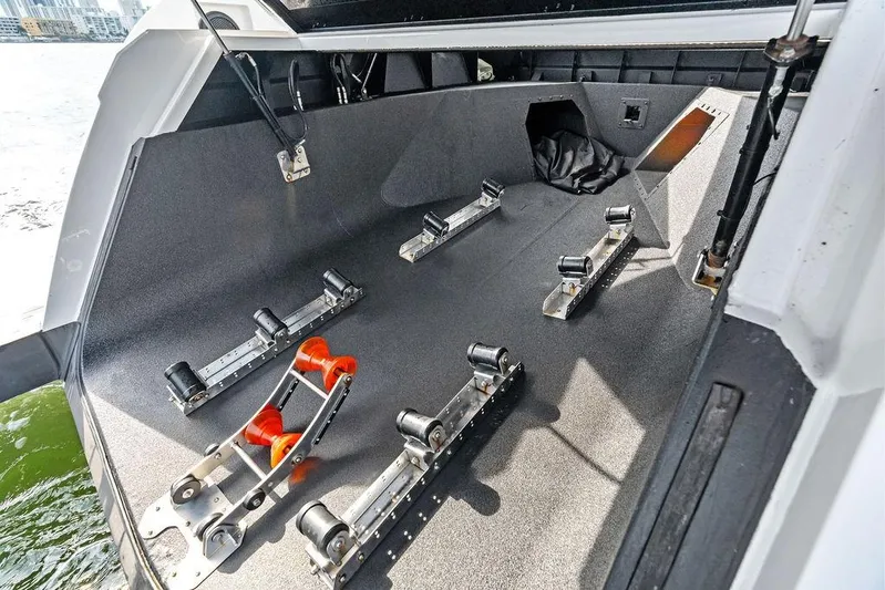 Shir Yacht Photos Pics 2024 Vanquish VQ58 boat interior with roller system for watercraft storage.