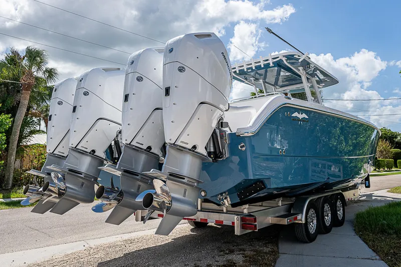  Yacht Photos Pics 2025 Invincible 38 Catamaran with four powerful outboard engines on a trailer.