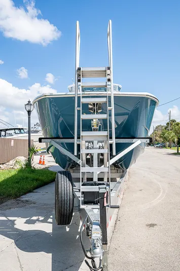  Yacht Photos Pics 2025 Invincible 38 Catamaran on trailer, front view, under clear blue sky.