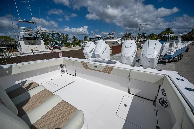 Yacht Photos Pics 2025 Invincible 38 Catamaran with quad engines, spacious deck, and luxurious seating.