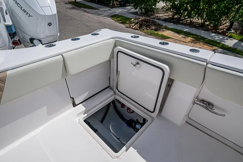  Yacht Photos Pics 2025 Invincible 38 Catamaran deck with open storage compartment.