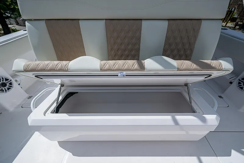  Yacht Photos Pics 2025 Invincible 38 Catamaran seat storage compartment open, showcasing spacious interior.