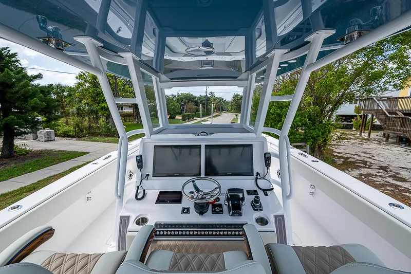  Yacht Photos Pics 2025 Invincible 38 Catamaran cockpit with advanced navigation system and luxurious seating.