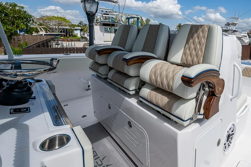  Yacht Photos Pics 2025 Invincible 38 Catamaran with luxurious seating and modern helm design.