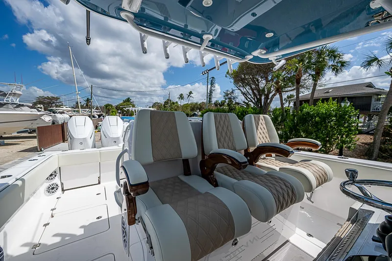  Yacht Photos Pics 2025 Invincible 38 Catamaran interior with luxurious seating and modern design.