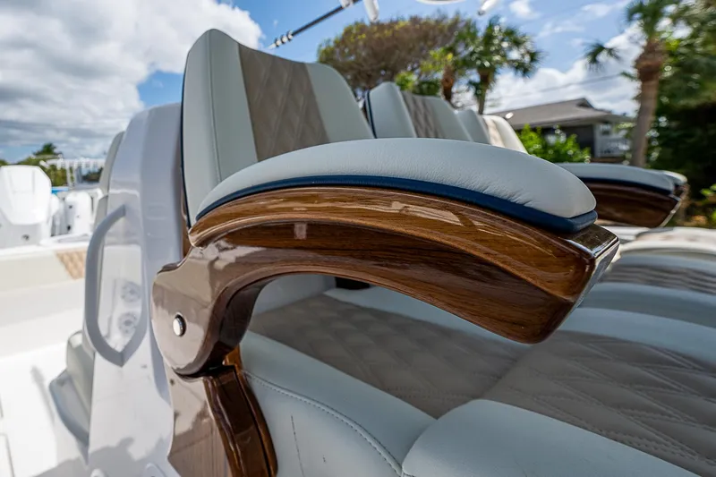  Yacht Photos Pics Luxurious seating on 2025 Invincible 38 Catamaran with elegant wood accents and plush upholstery.