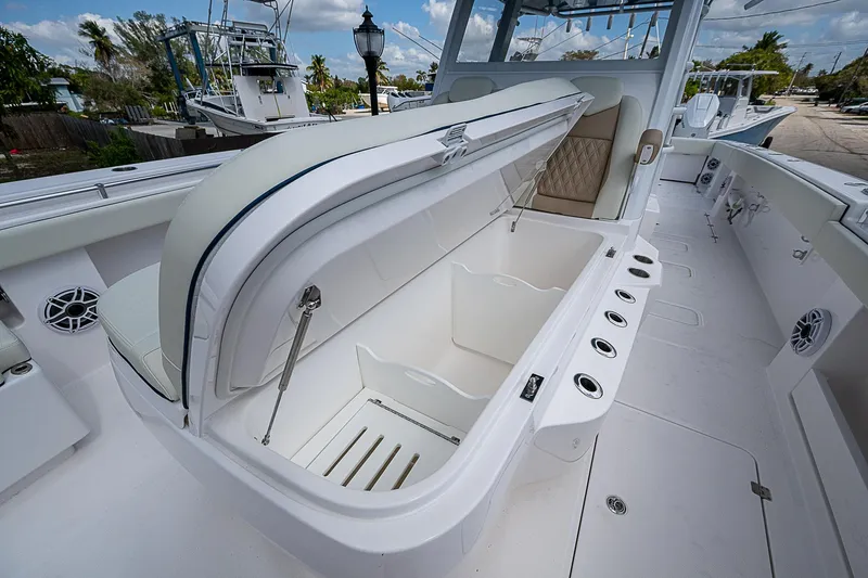  Yacht Photos Pics 2025 Invincible 38 Catamaran with open storage compartment on deck.