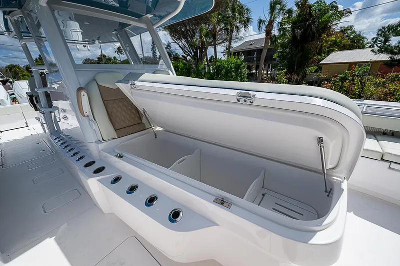  Yacht Photos Pics 2025 Invincible 38 Catamaran with open storage compartment on deck.