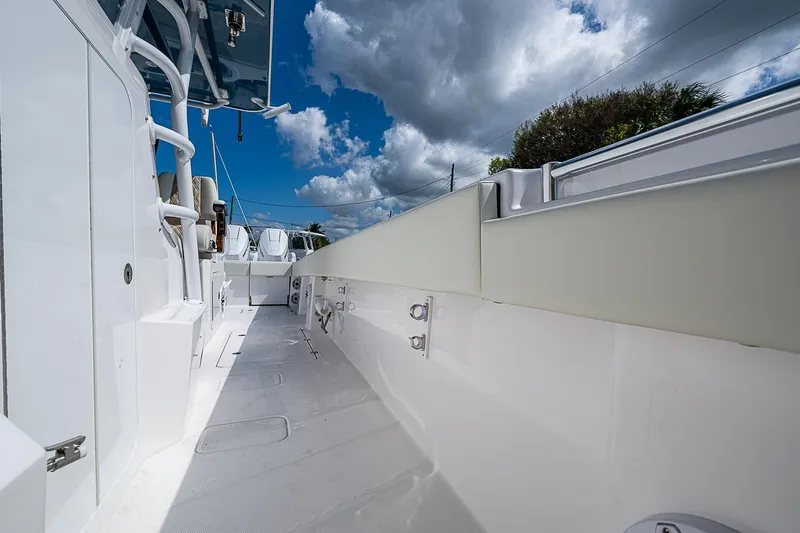  Yacht Photos Pics 2025 Invincible 38 Catamaran deck under a cloudy sky.