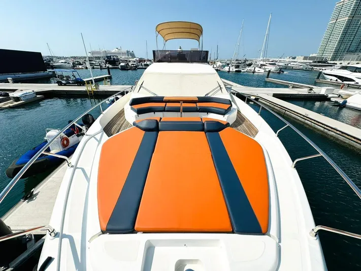  Yacht Photos Pics 2015 Ferretti Yachts 550 with vibrant orange and blue deck, docked at a marina.