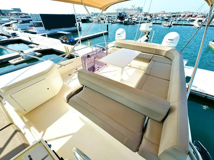  Yacht Photos Pics Luxurious 2015 Ferretti Yachts 550 with spacious deck seating at marina.