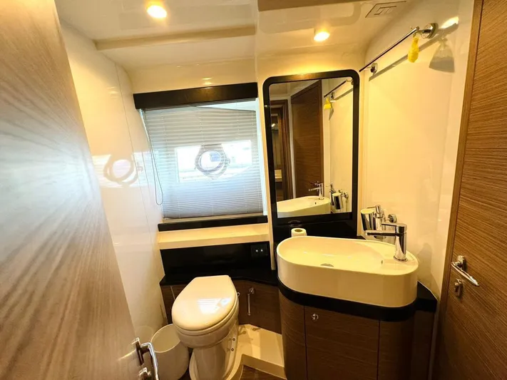  Yacht Photos Pics Luxurious bathroom in a 2015 Ferretti Yachts 550, featuring modern fixtures and elegant design.