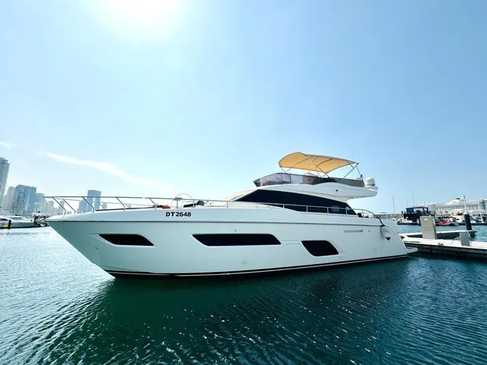  Yacht Photos Pics Ferretti Yachts 550, 2015 model, docked in a marina under clear blue skies.