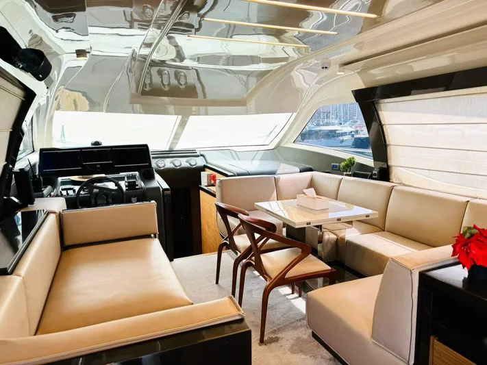  Yacht Photos Pics Luxurious interior of a 2015 Ferretti Yachts 550, featuring elegant seating and dining area.