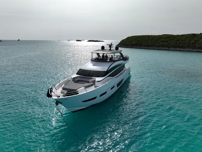 Record Year Yacht Photos Pics 2021 Princess Y85 Motor Yacht on turquoise waters, near lush green islands.