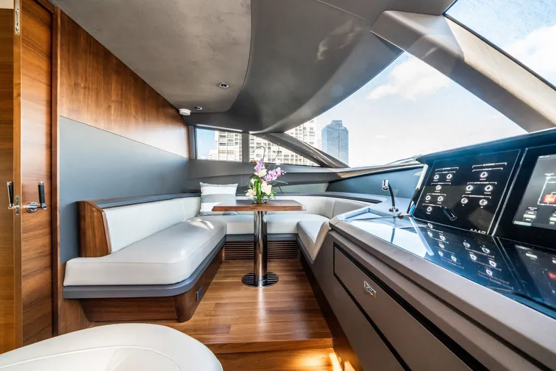 Record Year Yacht Photos Pics Luxurious interior of 2021 Princess Y85 Motor Yacht with modern seating and control panel.